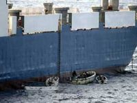 Sept. 28: Somali pirates in small boats are seen alongside the hijacked 'Faina.' (AP) Sept. 28: Somali pirates in small boats are seen alongside the hijacked 'Faina.' (AP)