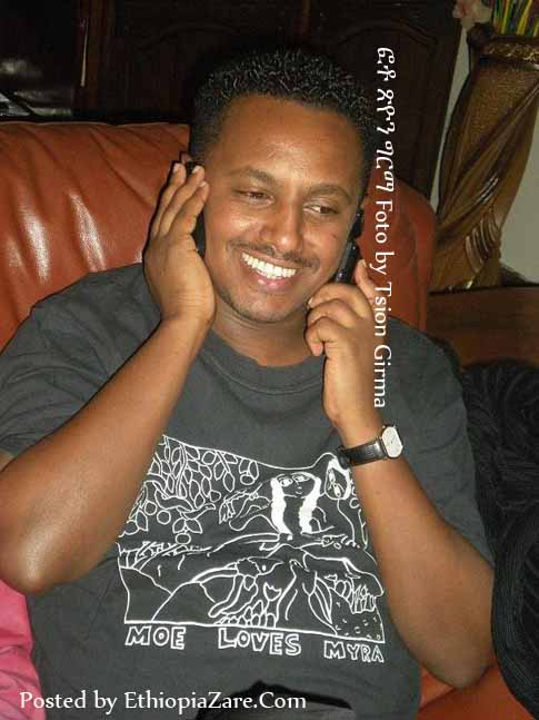 Talking with 2 mobiles, after one hour of his release እቤቱ ከገባ ከአንድ ሰዓት በኋላ በሁለት ሞባይል ስልክ ሲያወራ 