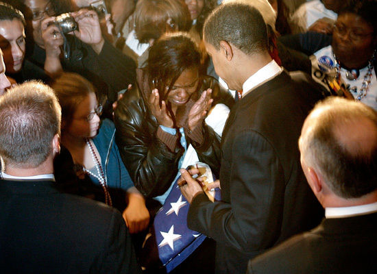 St. Louis, Missouri, February 2nd. Lisa Wells-Blackmon cries as Obama signs the flag that covered her brother's casket. Her brother was in the military and killed in Afghanistan. St. Louis, Missouri, February 2nd. Lisa Wells-Blackmon cries as Obama signs the flag that covered her brother's casket. Her brother was in the military and killed in Afghanistan.