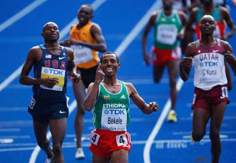 BERLIN - AUGUST 23: Kenenisa Bekele of Ethiopia crosses the line to win the gold medal in the men's 5000 Metres Final during day nine of the 12th IAAF World Athletics Championships at the Olympic Stadium on August 23, 2009 in Berlin, Germany. BERLIN - AUGUST 23: Kenenisa Bekele of Ethiopia crosses the line to win the gold medal in the men's 5000 Metres Final during day nine of the 12th IAAF World Athletics Championships at the Olympic Stadium on August 23, 2009 in Berlin, Germany.