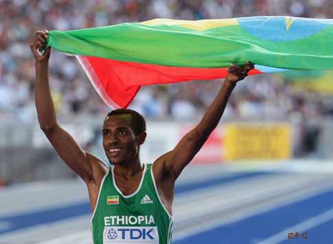 BERLIN - AUGUST 23: Kenenisa Bekele of Ethiopia celebrates winning the gold medal in the men's 5000 Metres Final during day nine of the 12th IAAF World Athletics Championships at the Olympic Stadium on August 23, 2009 in Berlin, Germany. BERLIN - AUGUST 23: Kenenisa Bekele of Ethiopia celebrates winning the gold medal in the men's 5000 Metres Final during day nine of the 12th IAAF World Athletics Championships at the Olympic Stadium on August 23, 2009 in Berlin, Germany.