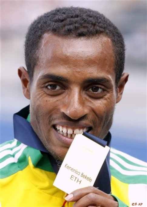 Ethiopia's Kenenisa Bekele bites the gold medal he won in the final of the Men's 5000m during the World Athletics Championships in Berlin on Sunday, Aug. 23, 2009. Ethiopia's Kenenisa Bekele bites the gold medal he won in the final of the Men's 5000m during the World Athletics Championships in Berlin on Sunday, Aug. 23, 2009.